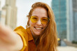 © PinkCoffee Studio - Summer selfie. Young beautiful woman makes selfie portrait on her phone.