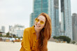 © PinkCoffee Studio - Young beautiful enjoyed woman with red hair on the beach