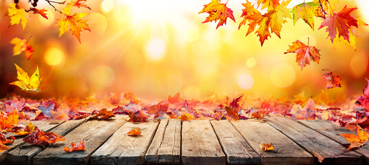 Wall Mural - fall table - autumn leaves falling on wooden plank