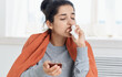 © SHOTPRIME STUDIO - woman having a cold with a cup of tea medications treatment health problems