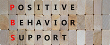 Positive Behavior Support Symbol. Concept Words Positive Behavior Support On Wooden Blocks On A Beautiful Wooden Background. Business, Psychological And Positive Behavior Support Concept. Copy Space.