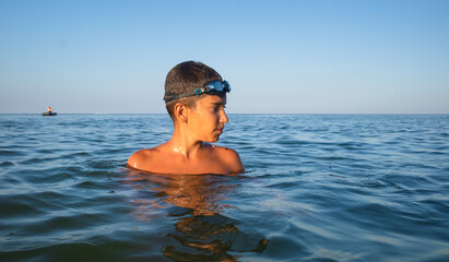  boy bathes in the sea