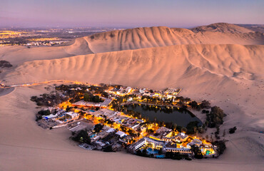 Wall Mural - Aerial sunset view of the Huacachina Oasis in Peru