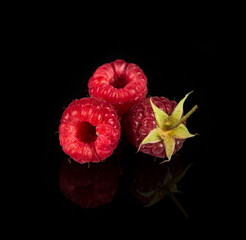 Raspberry isolated. Raspberries with leaf isolate. Raspberry with leaf isolated on black background