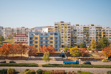 Wall Mural - Facades of buildings of different colors on a street in Kardhali in Bulgaria