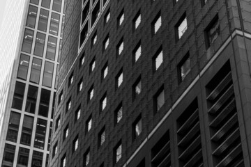 Wall Mural - Black and white tone, Exterior architectural detail modern facade of High-rise office buildings. Abstract Urban metropolis background.