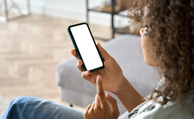 over shoulder closeup view of afro american girl holding in hands cell smartphone looking at empty b