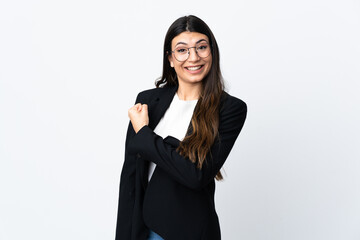 Wall Mural - Business woman over isolated white background celebrating a victory