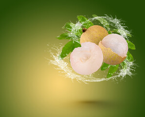 Poster - Water splash on longan with leaf isolated on green background