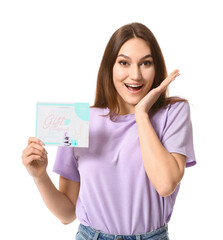 Poster - Surprised young woman with gift certificate for massage on white background