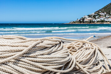 traditional fishing net on small rowing boat on beach