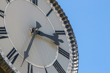 Wall Mural - Metal dial and chairs of a street clock in the park