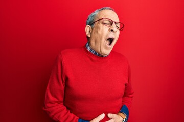 Sticker - Handsome senior man with grey hair wearing casual clothes and glasses with hand on stomach because nausea, painful disease feeling unwell. ache concept.