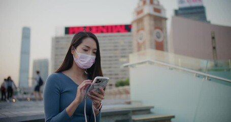 Poster - Woman wear face mask and use of mobile phone at outdoor