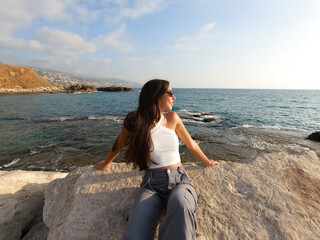 Wall Mural - Happy young girl at the sea. Summer fun