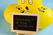 © gelmold - Yellow emoji balloons and a board with the inscription events on a blue background.