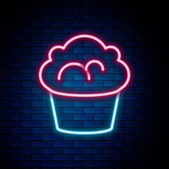 Canvas Print - Glowing neon line Muffin icon isolated on brick wall background. Colorful outline concept. Vector