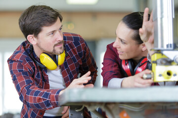 woman and man flirting in workshop