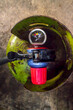 amperage gas regulator on a green gas cylinder.