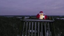 Aerial View Around Santa Claus With A Lantern, In A Watchtower, Polar Night In Lapland - Orbit, Drone Shot