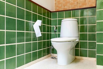 Wall Mural - White ceramic toilet in a classic toilet