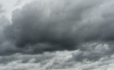 Wall Mural - Overcast sky. Dramatic gray sky and white clouds before rain in rainy season. Cloudy and moody sky. Storm sky. Cloudscape. Gloomy and moody background. Overcast clouds. Halloween day background.