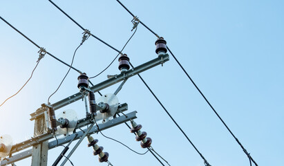 Wall Mural - Three-phase electric power for transfer power by electrical grids. Electric power for support manufacturing industry. High voltage electric poles and wire lines against blue sky. Power and enerygy.