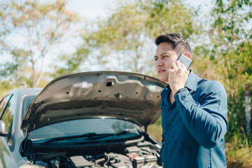 Poster - young man calling,  texting for car service on roadside assistance after broken car. Car broken, car breakdown concept.