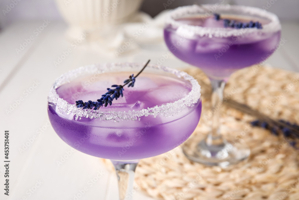 Glasses of fresh cocktail with lavender on table, closeup