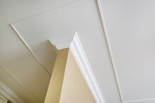 Detail Of Corner Ceiling And Walls With Intricate Crown Moulding. Interior Construction And Renovation Concept.