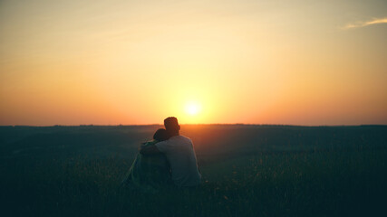 The man and woman admiring the beautiful sunset view