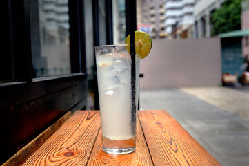 Sticker - View of lemonade on a wooden table in the cafe outdoors