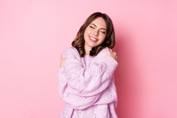 Sticker - Photo of charming inspired lady embrace shoulders wear knitted sweater isolated pink color background