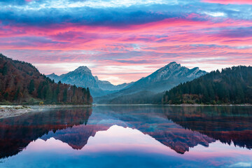 Wall Mural - peaceful autumn view on obersee lake in swiss alps. dramatic sunset sky and mountains reflections in