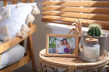 Canvas Print - Frame with photo of lovely family on table indoors