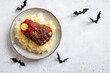 © azurita - Halloween baked meatloaf feet with mashed potato