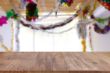 Wall Mural - Jewish festival of Sukkot. Traditional succah (hut) with decorations. Empty wooden old table for product display and presentation.