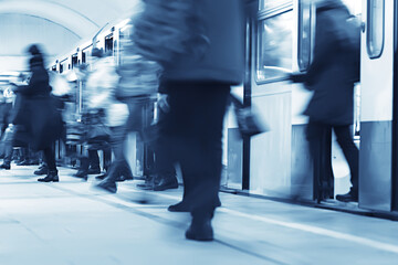 Wall Mural - crowd of people metro in motion blurred, abstract background urban traffic people