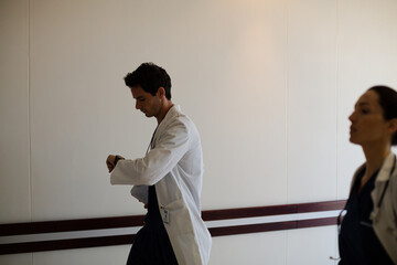 Wall Mural - Doctors rushing down hospital corridor