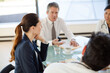 © KOTO - Doctors and businesswoman talking in meeting
