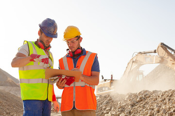 Worker using laptop on site