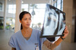 © KOTO - Nurse examining chest x-rays in hospital