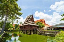 Beautiful Of Tripitaka Storage Tower.Thai Wooden Temple Architecture In The Middle Of The Pond At Wat Thung Si Muang In Ubon Ratchathani Province, Thailand, ASIA.