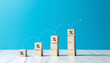 © Warakorn - wooden block cubes with rising business graph
