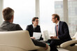© KOTO - Businessmen sitting in meeting