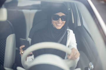 Muslim woman drives a car