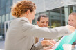 © KOTO - Business people talking outdoors