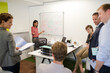 © KOTO - Businesswoman drawing on whiteboard in meeting