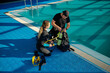 © Nomad_Soul - Male instructor explains how scuba gear works