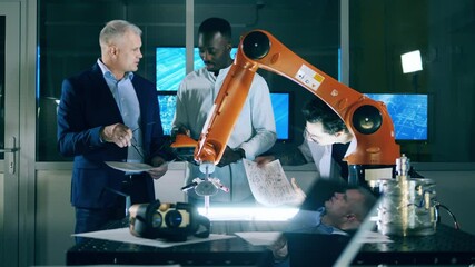 Wall Mural - robotics engineers are studying cybernetic devices